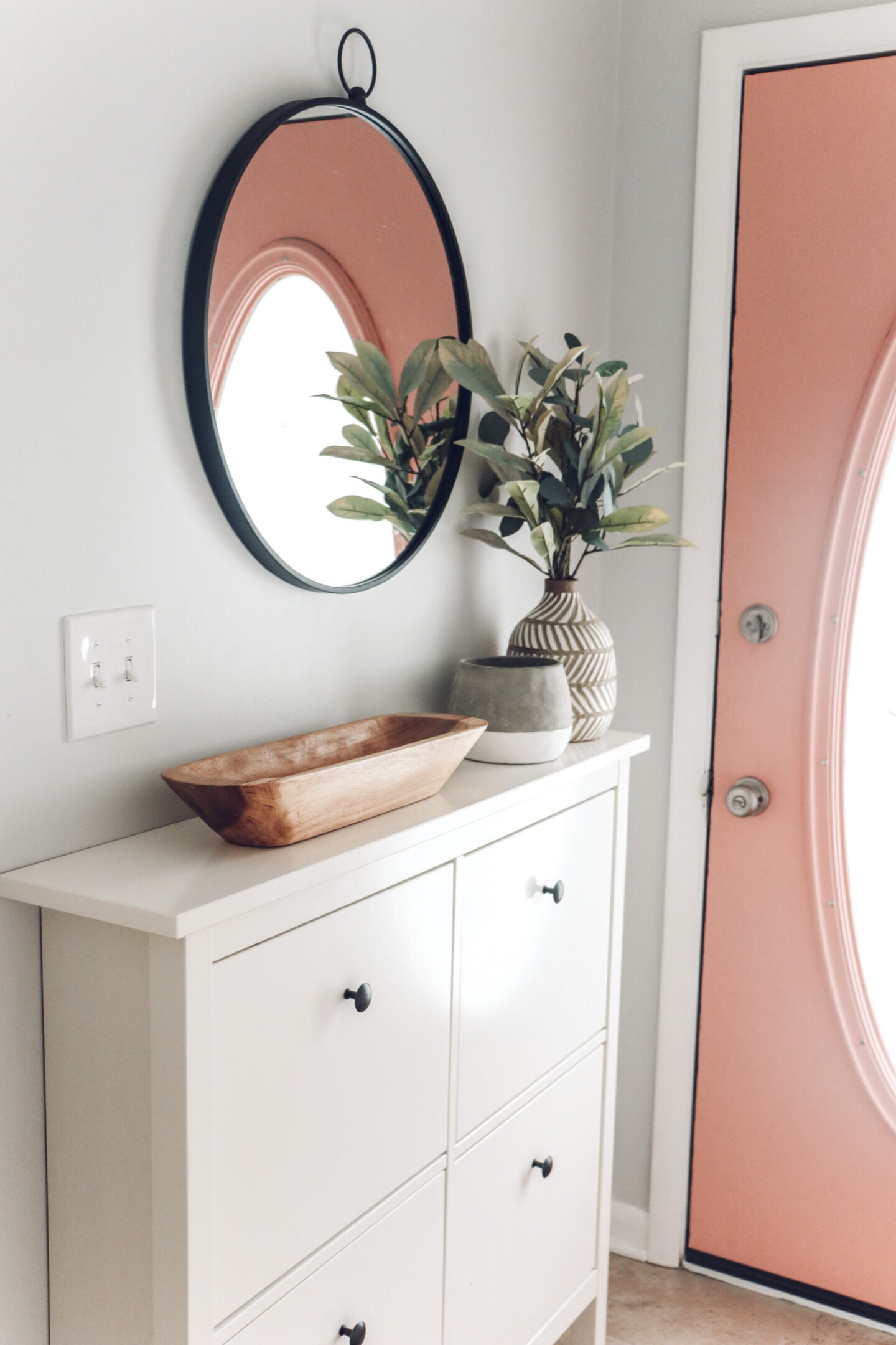 small entryway pink door